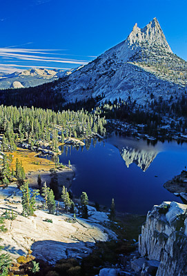 Cathedral Peak reflects in Cathedral Lake, Yosemite National Park, California, USA.